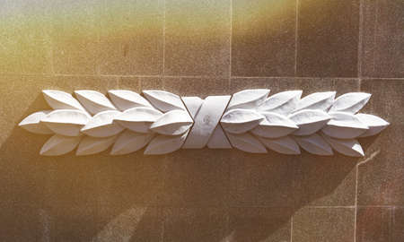 Commemorative memorial. Laying flowers at the eternal fire. Tribute to the memory of the fallen soldiers. Flowers and a soldering iron for soldiers.の写真素材