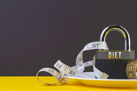 certain diet. obesity problems. Healthy food concept. Fitness workout and diet for weight loss.の写真素材
