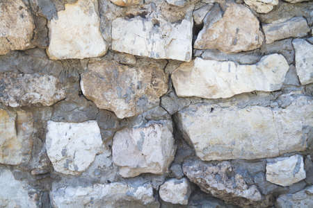 Texture of old stone. Old wall with a crack.Grunge background in dark color.の写真素材