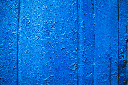 cracked paint texture. Grunge wall texture. Dark wall with old paint. The wall is crumbling with age.の写真素材