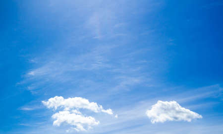 summer sky. Cumulus clouds on a blue background. partly cloudy. Dark clouds and white clouds.の写真素材