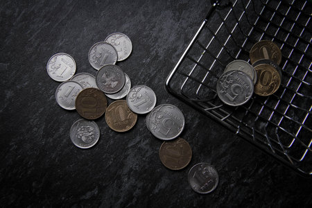 food price. Money and a grocery basket. Payment in the store. Small change in the basket. small...
