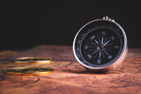 Compass and bitcoin. Travel and cryptocurrencies. Buying tickets with bitcoins. Alternative currency...