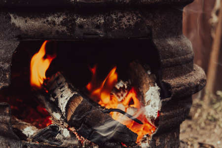 wood burning. The rest of the hive. Burnt firewood. Ashes in the cauldron. Remains of the fire.