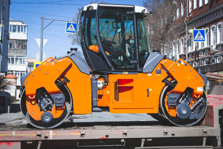 Cleaning the city from garbage. Washing roads with special equipment. Garbage removal to the landfill.の写真素材