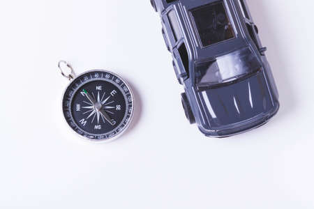 Tourist travel by car. Travel by car. Compass and car. Autotourism. Travel across countries by land.の写真素材