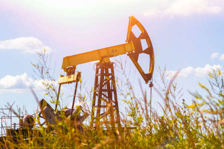 oil injection. oil production plant. gas production. oilfield site. Drilling rigs for the extraction of fossil fuels and crude oil. global crisis. War on oil and gas prices.の写真素材