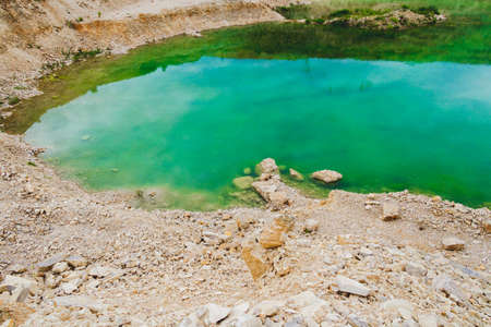 Lake formation in an old abandoned quarry. Termination of mining operations.