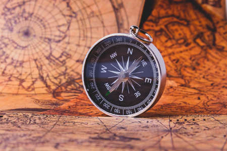 Looking for adventure. Compass and maps. Treasure map and path to the treasure. Travel and navigation. Tourist compass on the map. Travel itinerary.の写真素材
