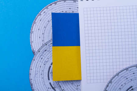 Tachographs in Ukraine. analog tachograph. Flag of Ukraine on the background of discs for recording the time of the truck driver.の写真素材