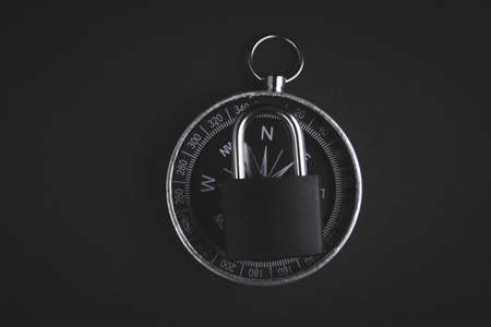 Compass and lock. Travel ban. Restriction of movement. Closed borders of countries. Canceled...