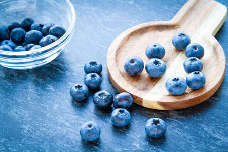 Blueberries on a wooden table. Fresh berries. Wild blueberries on a wooden stand. Copyspace.の写真素材