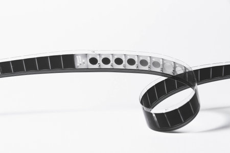 Vintage film strip isolated on white background. Film footage on film. Analog cinema. Old cinema.の写真素材