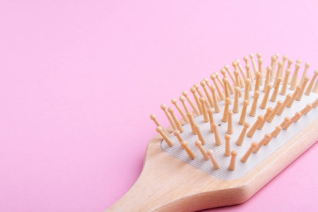 Massage comb to stimulate hair growth. Comb on isolated background. Beauty and hair care.の写真素材