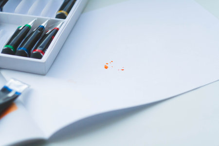 Artist's workplace. Paint and brushes on canvas. artist workflow. Sketches on paper. Drawing as art.の写真素材