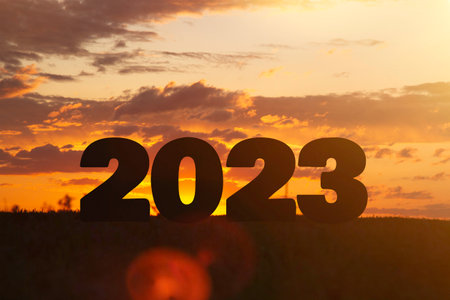 Year change. The beginning of a new year. New year concept. Symbol of start and greetings happy new year 2023. People enter 2023..の写真素材