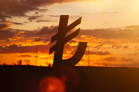 The banknote of the Turkish lira at sunset in the rays of the setting sun. sunset currency. Devaluation of money..の写真素材