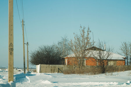 Winter landscape. A beautiful snow-covered village in the winter season. Small red brick houses in winter..の写真素材