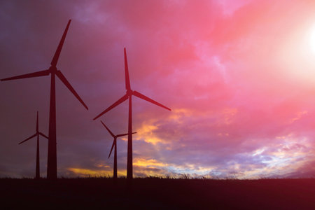 Concept of alternative energy. Wind turbine towers. Electricity from air. Green..