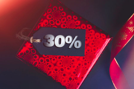 New Year discounts. Buying gifts. Sale on black friday. Gift box and price tag..の写真素材