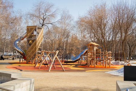 Childrens playground in the park. Swings and carousels for children outdoors..の写真素材