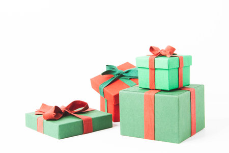 Present. Gift box with a bow. New Years surprise. Red and green box with a giftの写真素材