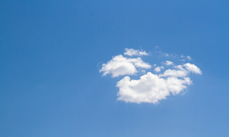Summer sky. Cumulus clouds on a blue background. Partly cloudy. Dark clouds and white clouds.の写真素材
