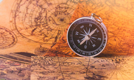 Looking for adventure. Compass and maps. Treasure map and path to the treasure. Travel and navigation. Tourist compass on the map. Travel itinerary.の写真素材