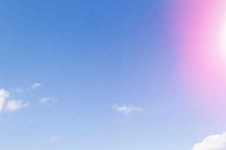 White airy beautiful clouds in a bright blue sky. Clear sunny weather. The concept of environmental safety and cleanliness..の写真素材