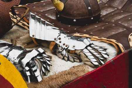 Knight's armor. Warrior's gloves and sword. Clothing and weapons of ancient knights..の写真素材