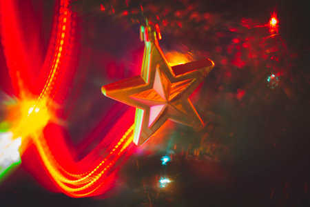 Christmas decorations and colored lights garlands on Christmas tree. Bright lights and highlights...