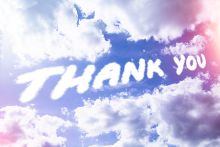 Thank you. Text from clouds in sky in bright sunlight..の写真素材