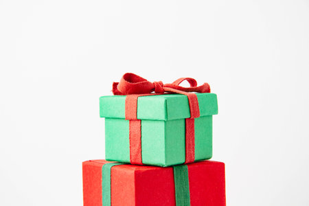 Present. Gift box with a bow. New Years surprise. Red and green box with a giftの写真素材