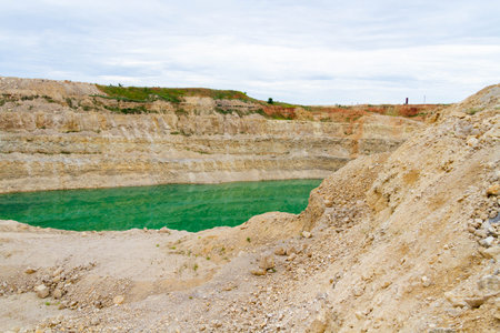 Lake formation in an old abandoned quarry. Quarry lake. Crushed stone dumps in a closed area for...