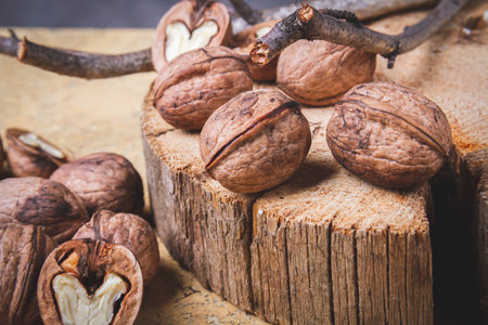 Walnut. Half walnut on natural background. Inshell nuts. Copyspace.