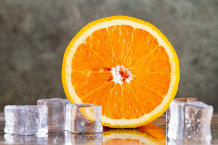 Orange and ice. Fresh ice juice. Fruity freshness of orange. Summer drink with orange juice ice.の写真素材
