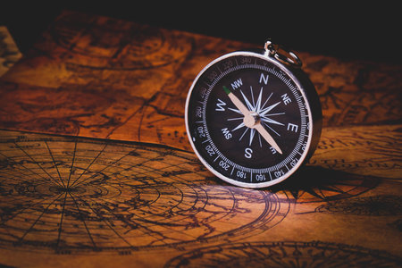 Looking for adventure. Compass and maps. Treasure map and path to the treasure. Travel and navigation. Tourist compass on the map. Travel itinerary.の写真素材