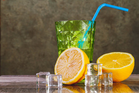 A glass of ice-cold lemon juice. Fruit juice with ice. Lemon slices and ice.の写真素材