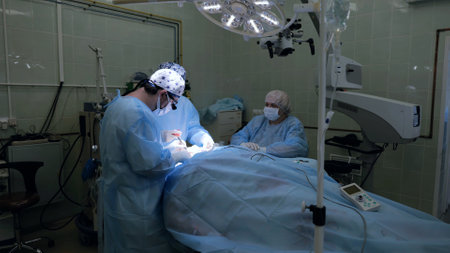 The surgeon performs a complex operation to restore the facial nerve. Surgical operation in a modern...