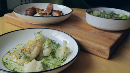 Ready meals, meat, fish and vegetable salad on the table, specialties from the restaurant, three...