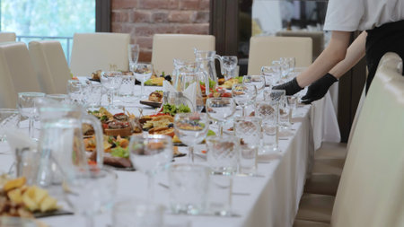 Business lunch. A beautiful festive table covered with a variety of food. Food and drinks on the...