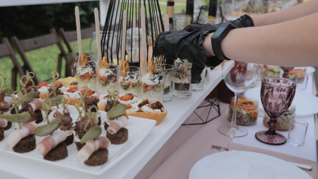Business lunch. A beautiful festive table covered with a variety of food. Food and drinks on the...