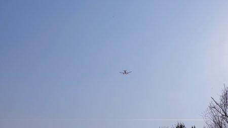 Airplane in the sky. Departure of a passenger flight. Airliner with passengers on the blue sky. The plane takes off against a clear sky. Transport concept. The plane is flying in the sky.の写真素材