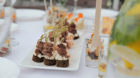 Beautiful delicious food and snacks on the festive table in the restaurant. Business lunch. A...