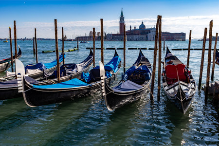 Venice, its characteristic architecture and gondolas, which enrich its magnificent scenery, and view of the church of San Giorgio Maggiore.の写真素材