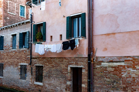 Venice, its characteristic architecture and its colours. The glimpse of an internal channel.の写真素材