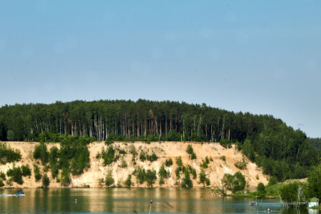 Summer landscape of the river and the forest on a sunny day.の写真素材