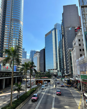 Street view with skyscrapers in Hong Kong. Hong Kong is one of the most densely populated areas in...