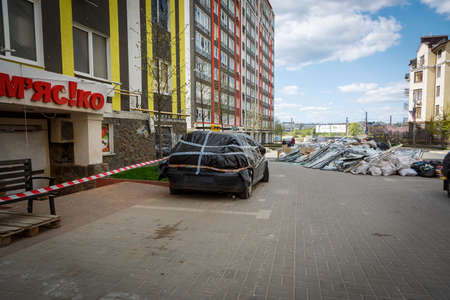 Cars in Irpin. May, 2022. Irpin, Kyiv region, Ukraine. Russia Ukraine war. Damaged in Irpin after fightingのeditorial素材
