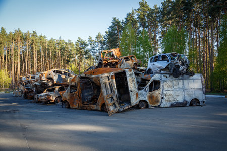 Cars in Irpin. May, 2022. Irpin, Kyiv region, Ukraine. Russia Ukraine war. Damaged in Irpin after fightingのeditorial素材